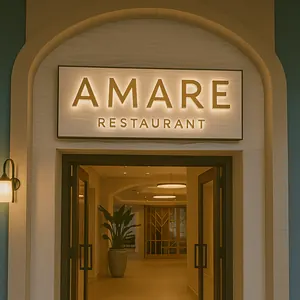 A dining area in Amare restaurant at Walt Disney World Swan Reserve with a glass wine display 