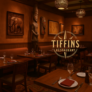 Um prato com filé-mignon e vieiras grelhados, batatas e legumes